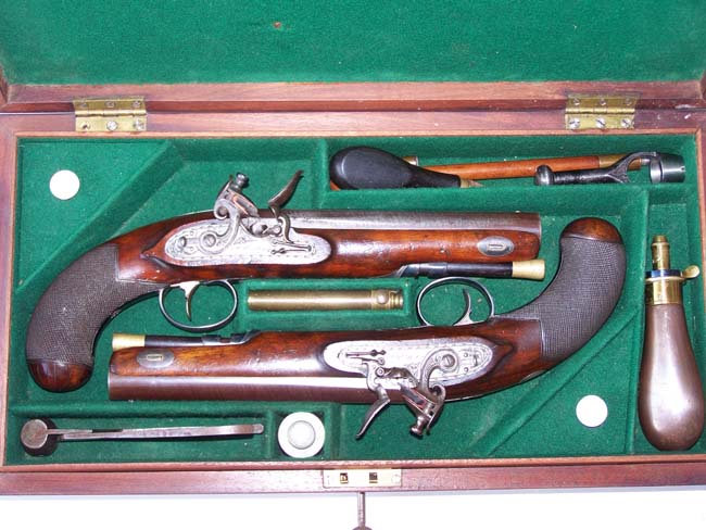 A Cased pair of English Flintlock 'Gentleman's' Traveling Pistols by Thomas Mortimer, GUNMAKER TO HIS MAJESTY, London, circa 1810-1815.